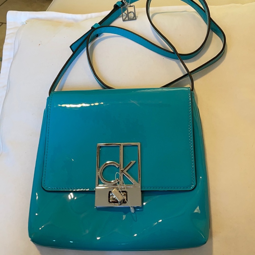 Calvin Klein Monogram Logo Flap Crossbody $188
